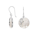Wholesale sterling silver earrings featuring round mother of pearl drops with a polished wave-motif overlay, offering consistent artisan craftsmanship and refined catalog-ready presentation for bulk jewelry buyers.