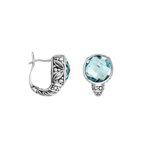 Wholesale sterling silver earrings featuring faceted blue topaz quartz set in ornate Balinese-style silverwork, crafted to provide consistent artisan quality and strong catalog-ready appeal for wholesale jewelry buyers.