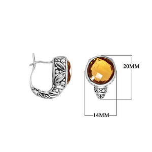 Wholesale sterling silver earrings featuring faceted citrine quartz set in ornate Balinese-style silver detailing, designed to deliver consistent artisan quality and strong catalog-ready presentation for wholesale jewelry buyers.