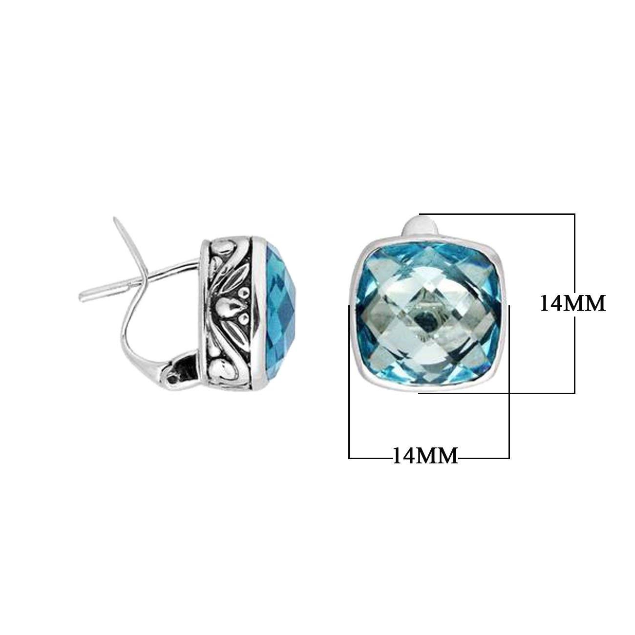 Pair of sterling silver cushion-cut Blue Topaz Quartz earrings with intricate ornamental side detailing and Omega clip locks, designed for elegant wholesale jewelry collections and catalogs.