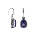 Wholesale sterling silver earrings featuring pear-shaped lapis cabochons framed with ornate Balinese-style detailing, crafted to deliver consistent artisan quality and strong catalog-ready appeal for wholesale jewelry purchases.