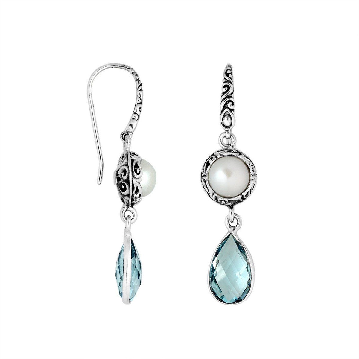 Wholesale sterling silver earrings featuring a round Mabe Pearl paired with a faceted Blue Topaz Quartz drop, surrounded by ornate Balinese detailing for consistent, catalog-quality wholesale presentation.
