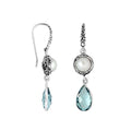 Wholesale sterling silver earrings featuring a round Mabe Pearl paired with a faceted Blue Topaz Quartz drop, surrounded by ornate Balinese detailing for consistent, catalog-quality wholesale presentation.