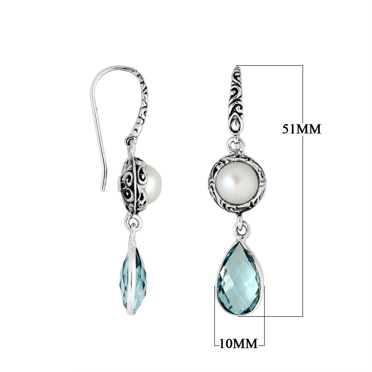 Wholesale sterling silver earrings featuring a round Mabe Pearl paired with a faceted Blue Topaz Quartz drop, surrounded by ornate Balinese detailing for consistent, catalog-quality wholesale presentation.