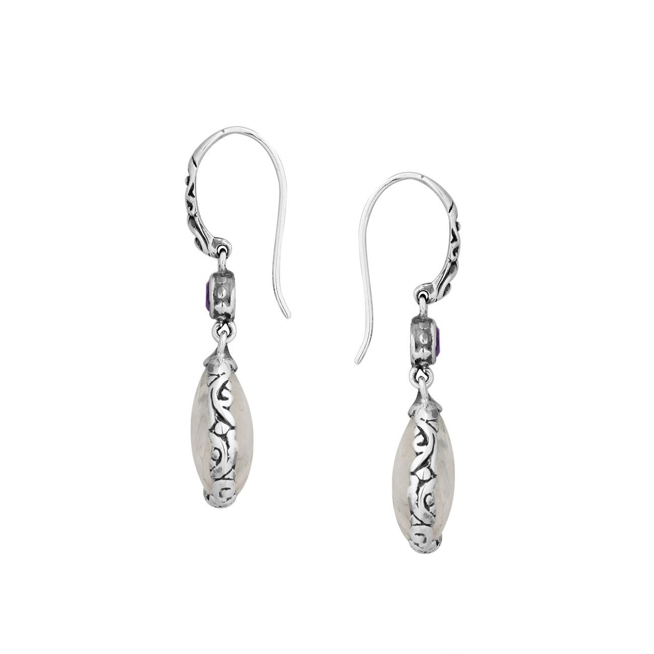 Wholesale sterling silver earrings featuring a faceted Rainbow Moonstone teardrop and Blue Topaz Quartz accent with ornate scroll designs and secure earwire, ideal for premium catalog displays.