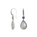 Wholesale sterling silver earrings combining a faceted rainbow moonstone teardrop with an amethyst quartz accent, framed by ornate Balinese detailing for consistent artisan quality and strong catalog-ready wholesale presentation.