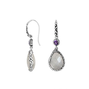 Wholesale sterling silver earrings combining a faceted rainbow moonstone teardrop with an amethyst quartz accent, framed by ornate Balinese detailing for consistent artisan quality and strong catalog-ready wholesale presentation.