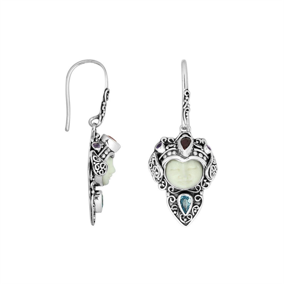 Wholesale sterling silver earrings featuring a carved Bone Face centerpiece adorned with Blue Topaz Quartz and Garnet Quartz accents, designed with ornate Balinese detailing for consistent artisan presentation.