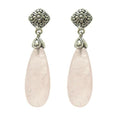 Wholesale sterling silver earrings featuring soft pink Rose Quartz teardrops paired with ornate Bali-style tops, crafted for consistent quality and elegant presentation in wholesale jewelry assortments.