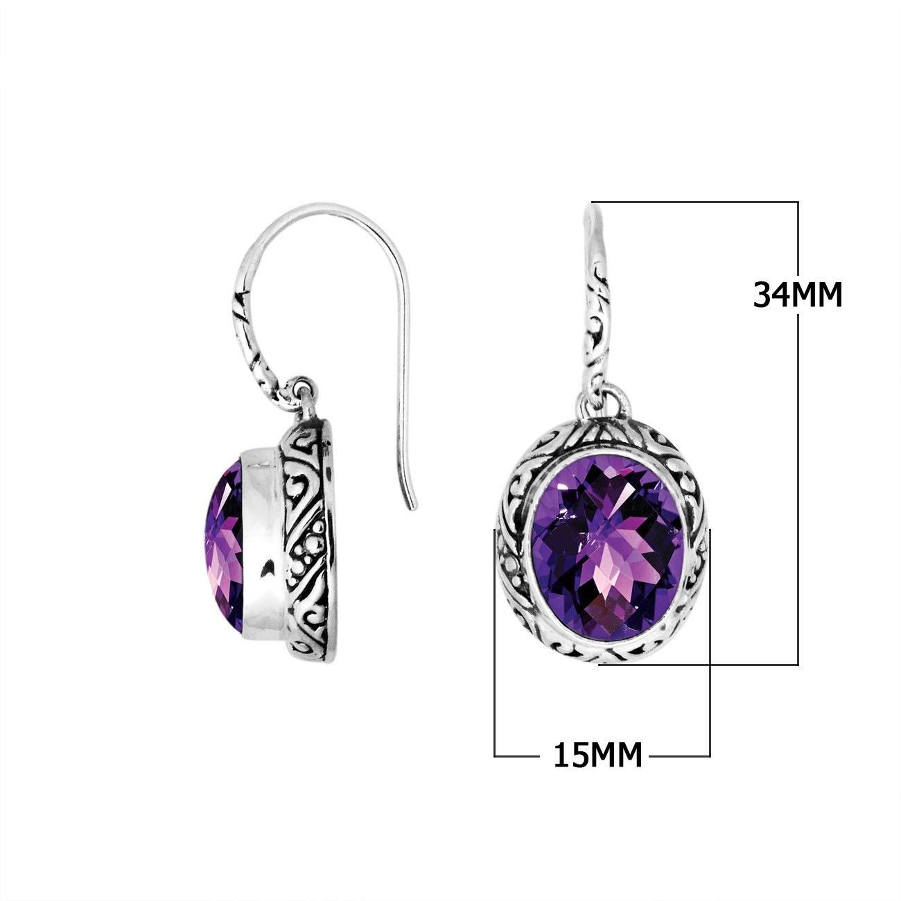 Wholesale sterling silver earrings featuring a faceted oval Amethyst Quartz stone framed with detailed carved silver accents and earwire lock, offering a vibrant artisan look ideal for premium jewelry catalogs.
