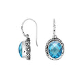 Wholesale sterling silver earrings featuring a faceted oval Blue Topaz Quartz stone framed with carved silver detailing and earwire lock, offering vibrant color and artisan styling ideal for premium jewelry catalogs.