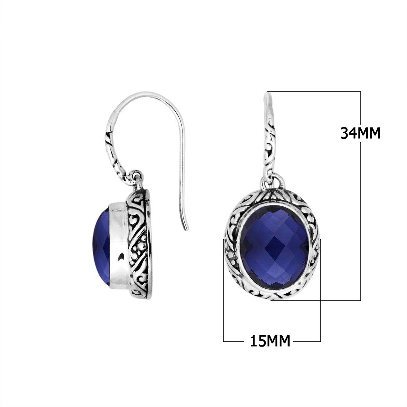 Wholesale sterling silver earrings featuring a faceted oval Sapphire stone framed with intricate carved detailing and earwire lock, offering deep blue brilliance and artisan craftsmanship ideal for premium wholesale jewelry catalogs.