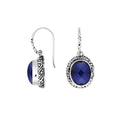 Wholesale sterling silver earrings featuring a faceted oval Sapphire stone framed with intricate carved detailing and earwire lock, offering deep blue brilliance and artisan craftsmanship ideal for premium wholesale jewelry catalogs.