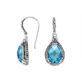 Wholesale sterling silver earrings featuring a faceted Blue Topaz Quartz teardrop framed with ornate carved detailing and an earwire lock, offering vivid color and artisan craftsmanship suited for premium wholesale jewelry catalogs.