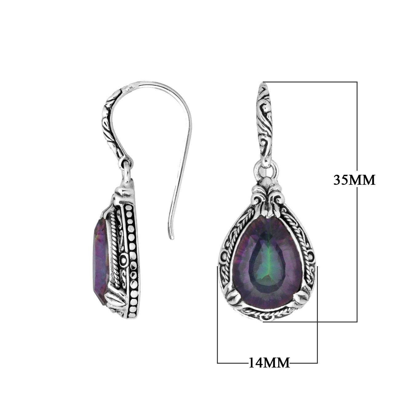 Wholesale sterling silver earrings featuring a multicolor Mystic Quartz teardrop with shifting purple and green hues, framed in detailed carved borders and finished with an earwire lock for vibrant artisan wholesale collections.
