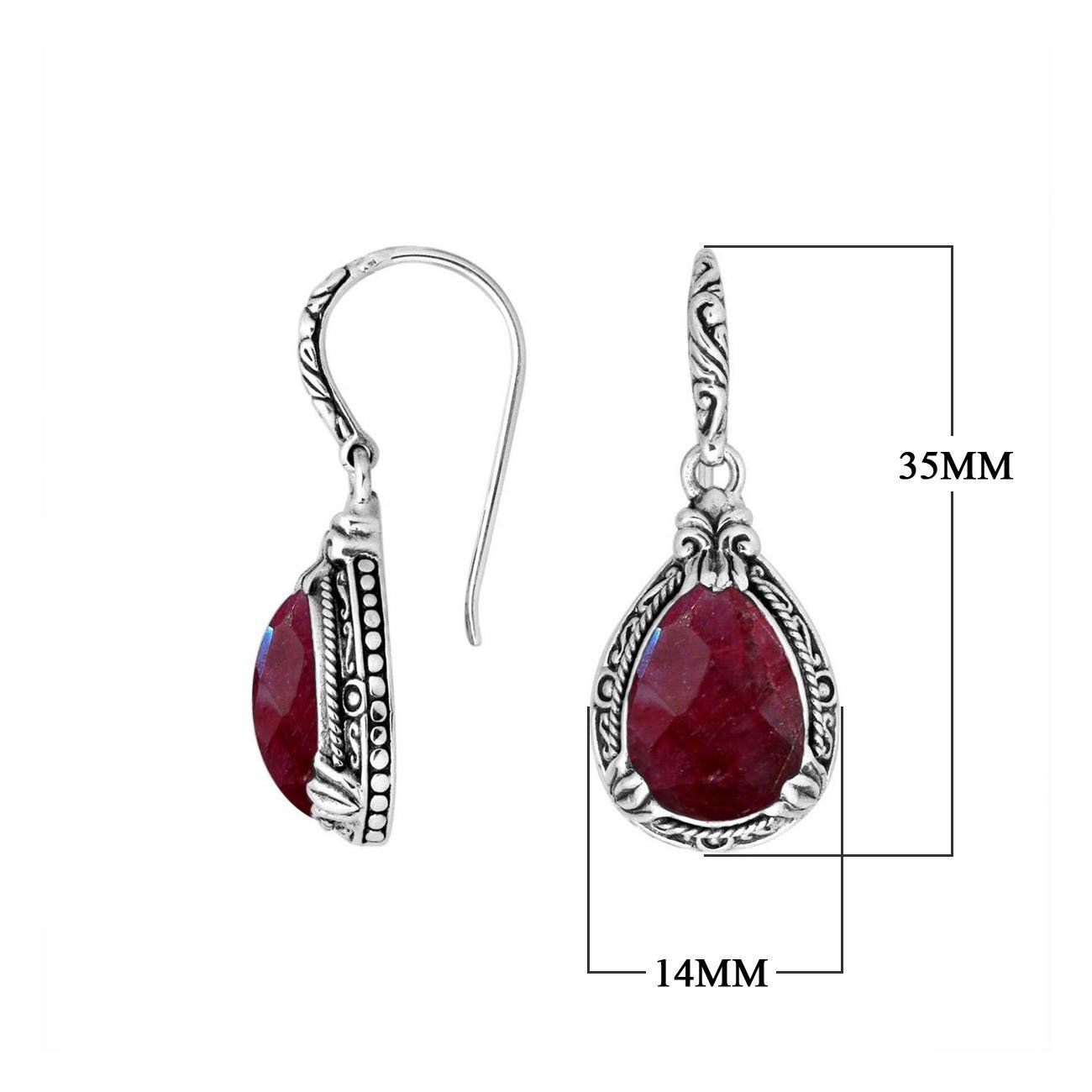 Wholesale sterling silver earrings featuring a deep-red Ruby Quartz teardrop framed with detailed ornamental carvings and earwire lock, offering vibrant color and artisan structure for high-end wholesale jewelry collections.
