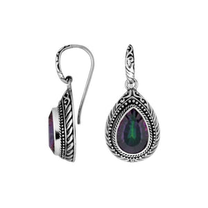 Wholesale sterling silver Mystic Quartz teardrop earwire earrings featuring intricately carved silver borders, decorative bead accents, antique-polished finish, and handcrafted artisanal detailing designed for premium jewelry collections.
