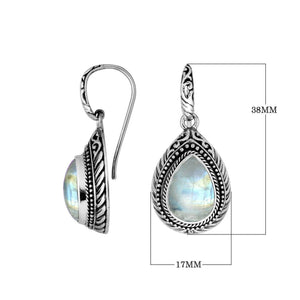 Wholesale sterling silver Rainbow Moonstone teardrop earwire earrings featuring carved silver borders, decorative bead accents, antique-polished finish, and handcrafted artisanal detailing designed for premium boutique jewelry collections.