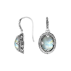 Sterling silver oval drop earrings with Rainbow Moonstone and decorative oxidized silver detailing for wholesale collections.