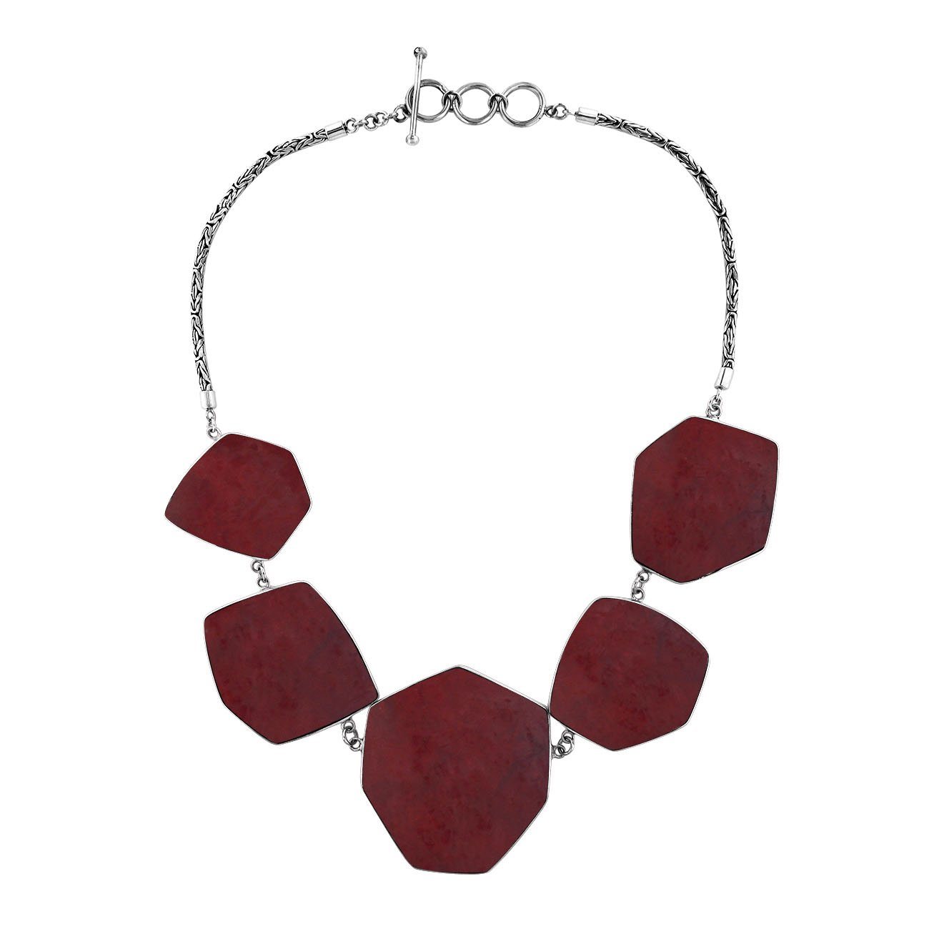 Sterling silver necklace with hexagon-shaped red coral links, polished artisan finish.