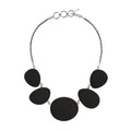 Sterling silver necklace with oval black shell links, polished artisan finish.