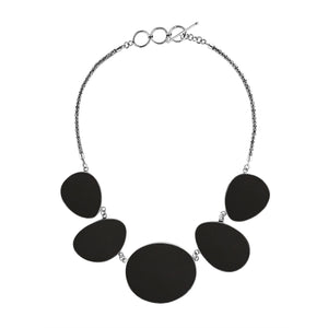 Sterling silver necklace with oval black shell links, polished artisan finish.