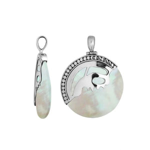 Sterling silver round pendant with luminous Mother of Pearl inlay and artistic silver overlay design, handcrafted Bali jewelry available for wholesale purchase.