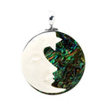 Sterling silver round pendant with carved bone face and abalone shell inlay, handcrafted Bali jewelry available for wholesale purchase.