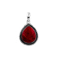 Sterling silver pear-shaped pendant with vibrant red coral centerpiece and granulated rope border, handcrafted Bali jewelry available for wholesale purchase.