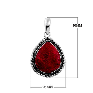 Sterling silver pear-shaped pendant with vibrant red coral centerpiece and granulated rope border, handcrafted Bali jewelry available for wholesale purchase.