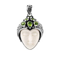 Wholesale sterling silver pendant with hand-carved bone face and peridot gemstones, Bali artisan jewelry in bulk.