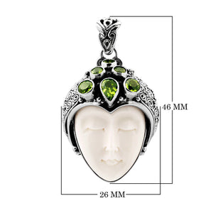 Wholesale sterling silver pendant with hand-carved bone face and peridot gemstones, Bali artisan jewelry in bulk.