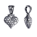 Wholesale sterling silver heart-shaped pendant with textured surface and ornate Balinese-style bail, handcrafted artisan jewelry from Bali.
