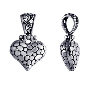 Wholesale sterling silver heart-shaped pendant with textured surface and ornate Balinese-style bail, handcrafted artisan jewelry from Bali.