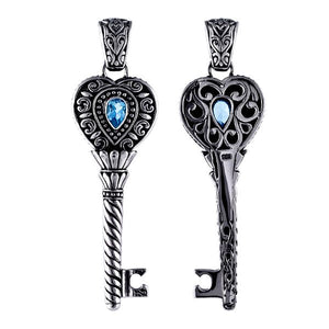 Wholesale sterling silver heart key pendant with genuine blue topaz gemstone and Balinese scrollwork, handcrafted artisan jewelry for bulk orders.