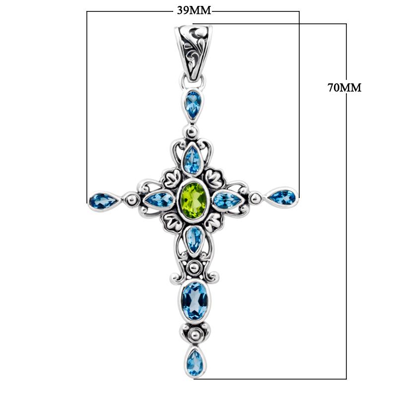 Wholesale sterling silver cross pendant with genuine peridot center stone and blue topaz accents, handcrafted Bali jewelry with ornate detailing for bulk orders.