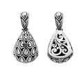 Sterling silver teardrop pendant with raised droplet motif and Bali swirl carvings, handcrafted in Bali.