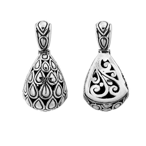 Sterling silver teardrop pendant with raised droplet motif and Bali swirl carvings, handcrafted in Bali.
