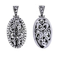 Sterling silver oval pendant with openwork Balinese swirl filigree and dotted edge, wholesale Bali jewelry.