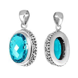 Sterling silver oval pendant with faceted Blue Topaz Quartz and ornate detailing, handcrafted in Bali