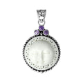 Wholesale sterling silver pendant with carved bone moon face and Amethyst Quartz accents, handcrafted in Bali.