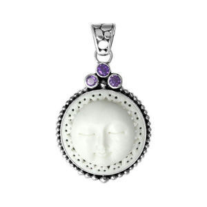 Wholesale sterling silver pendant with carved bone moon face and Amethyst Quartz accents, handcrafted in Bali.