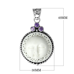 Wholesale sterling silver pendant with carved bone moon face and Amethyst Quartz accents, handcrafted in Bali.