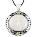 Wholesale Peridot Quartz and carved bone face sterling silver pendant handcrafted in Bali with Balinese artistry.