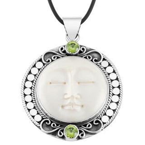 Wholesale Peridot Quartz and carved bone face sterling silver pendant handcrafted in Bali with Balinese artistry.