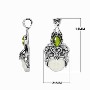 Wholesale bone face pendant with peridot quartz in sterling silver, handcrafted in Bali.