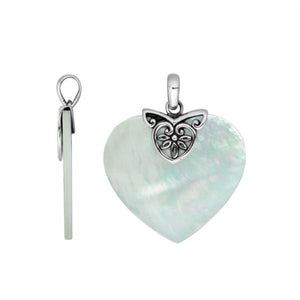 High-quality Sterling Silver Heart Pendant with radiant Mother Of Pearl and intricate filigree silver detailing, handcrafted by Balinese artisans for elegant wholesale jewelry collections.