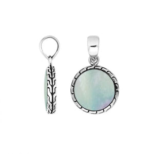 Round sterling silver pendant with mother of pearl and Balinese pattern handcrafted in Bali.