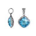 Sterling silver cushion pendant with blue topaz quartz and Balinese scroll pattern handcrafted in Bali.