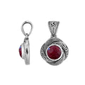 A stunning sterling silver pendant featuring a radiant Ruby Quartz encased in ornate swirl filigree design, showcasing authentic Balinese craftsmanship and artistic silver detailing.